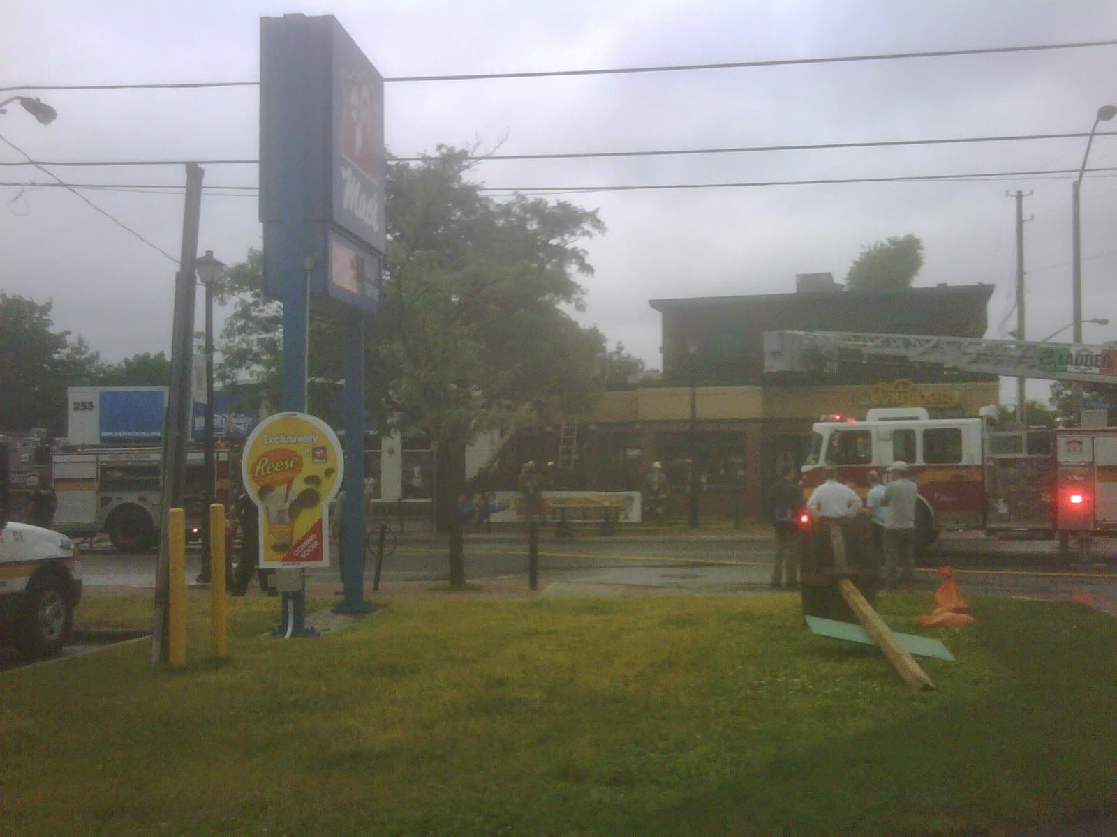 June 24, 2011 - my cell phone snapped this photo through the misty morning air, soon after the fire trucks had arrived on scene.